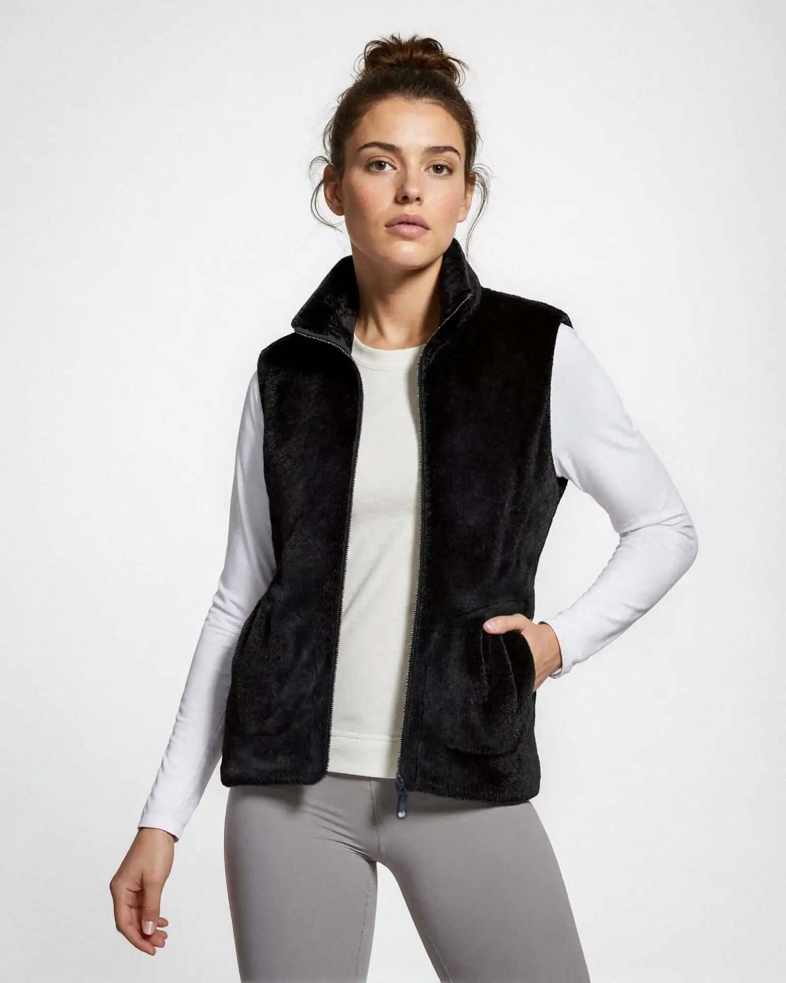 Women’s black faux fur vest with a high collar and zippered front.